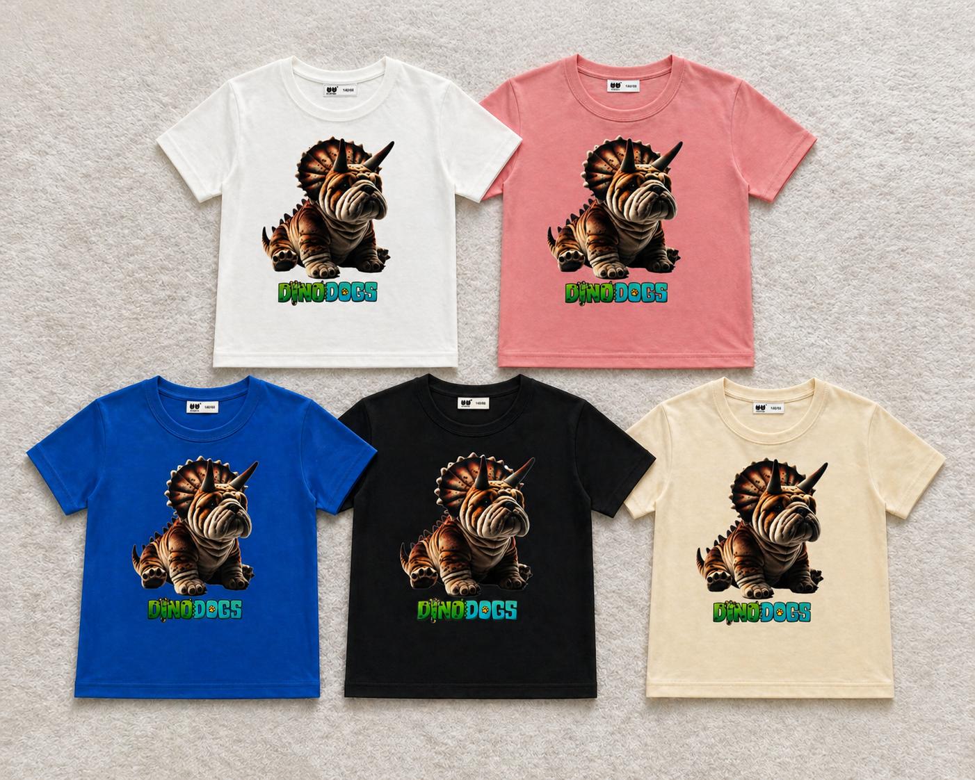 Axel the triceratops bulldog hybrid is on 5 different color t-shirts - blue, black, beige, white, and pink. 